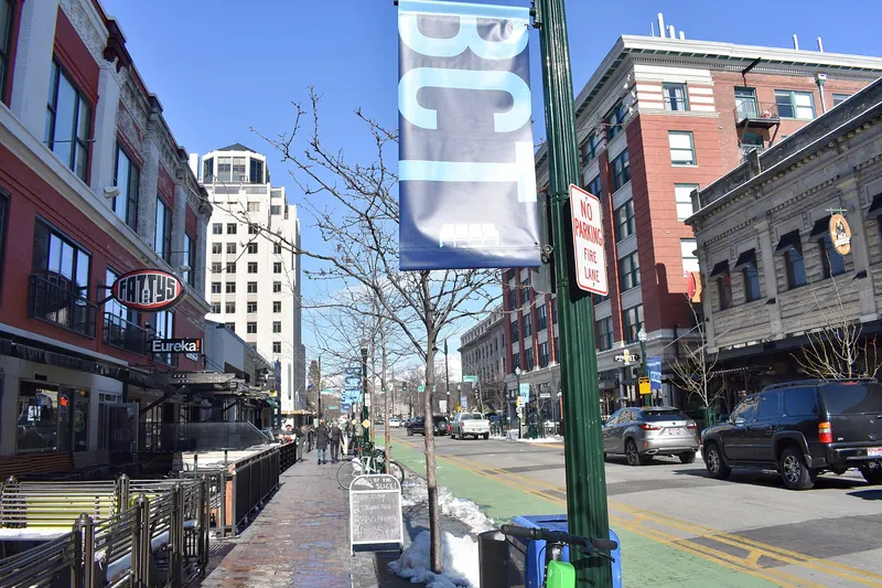 Downtown Boise street lined with buildings and parked cars