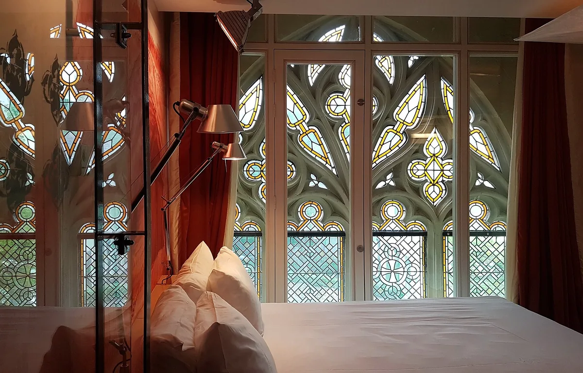 Comfortable hotel room with twin beds and warm lighting